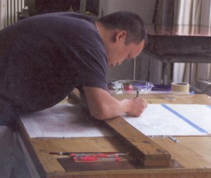 Yun-Fei Ji at his drafting table, courtesy Yun-Fei Ji and James Cohan Gallery